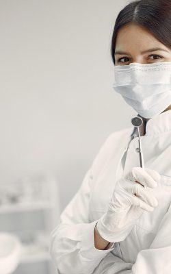 Beautiful dentist working on a dental clinic